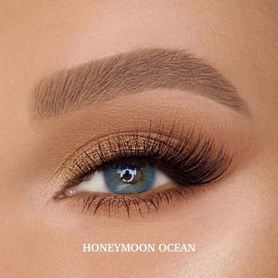 Honeymoon Ocean colored contact lenses with a rich deep blue-green hue for a natural enhancement