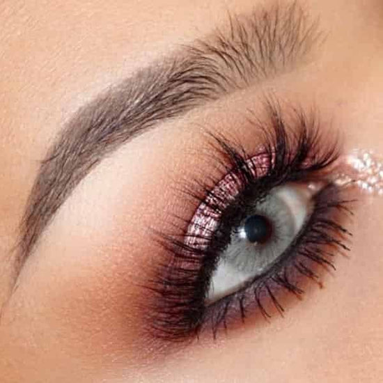 Solotica Hidrocor Cristal colored contact lenses before and after transformation on dark eyes.