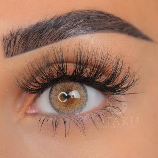 Best silver-grey contact lenses for dark eyes, featuring high opacity and a defined limbal ring for contrast.