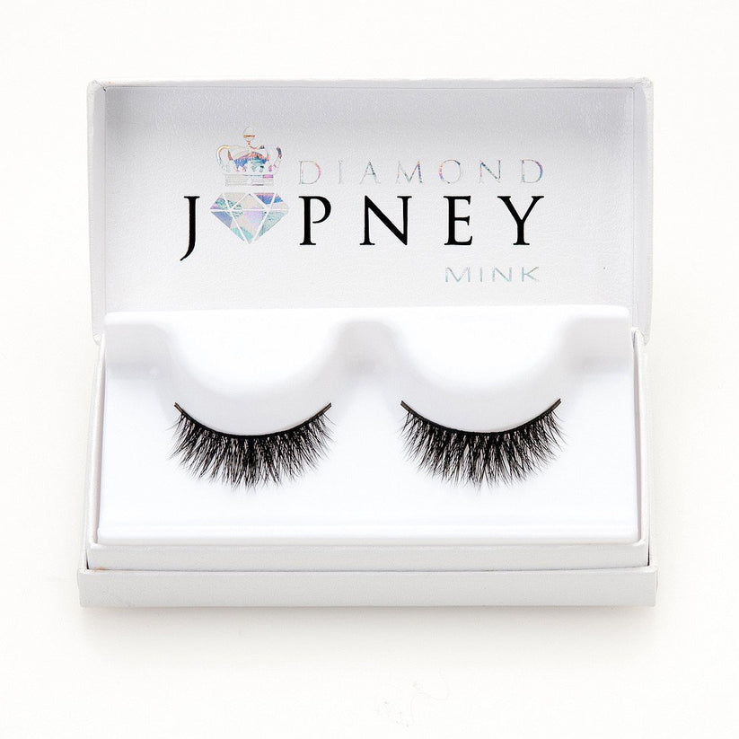 Irresistible Faux Mink Lashes with a wispy, cat-eye effect and fluffy winged ends.