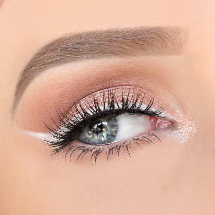 Natural cat-eye faux mink strip lashes designed for a subtle winged lift and soft volume.