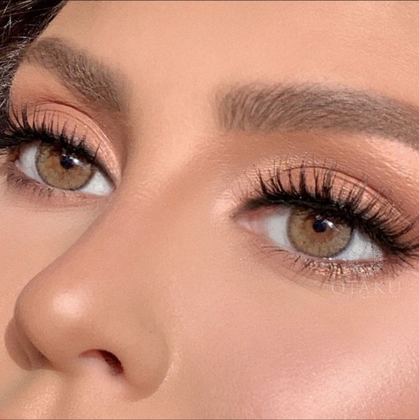 Before and after transformation with Otaku Brown Sugar contact lenses on dark brown eyes.