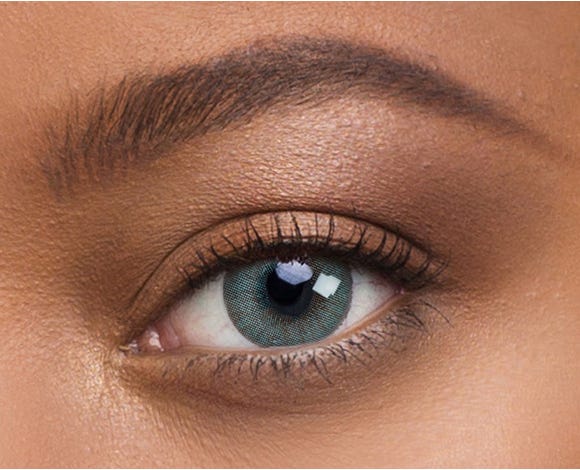 Before and after transformation with Solotica Hidrocor Aquamarine lenses on dark brown eyes