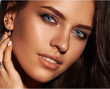 Before and after transformation with Solotica Hidrocor Safira lenses on dark brown eyes.